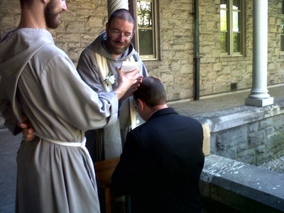 Fr John Paul CFR bestows blessing.jpg